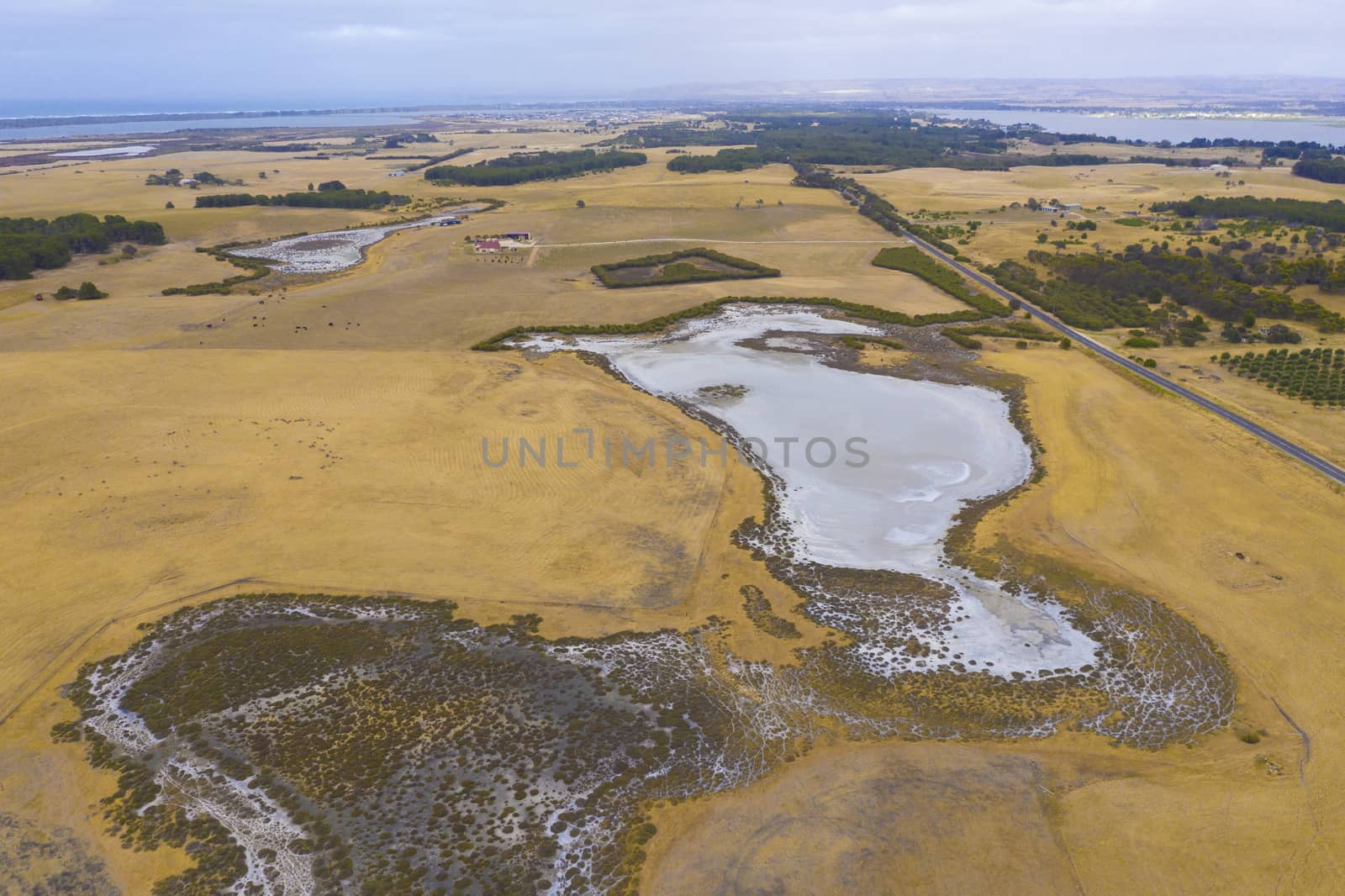 Aerial view of an agricultural irrigation dam affected by drought in regional Australia