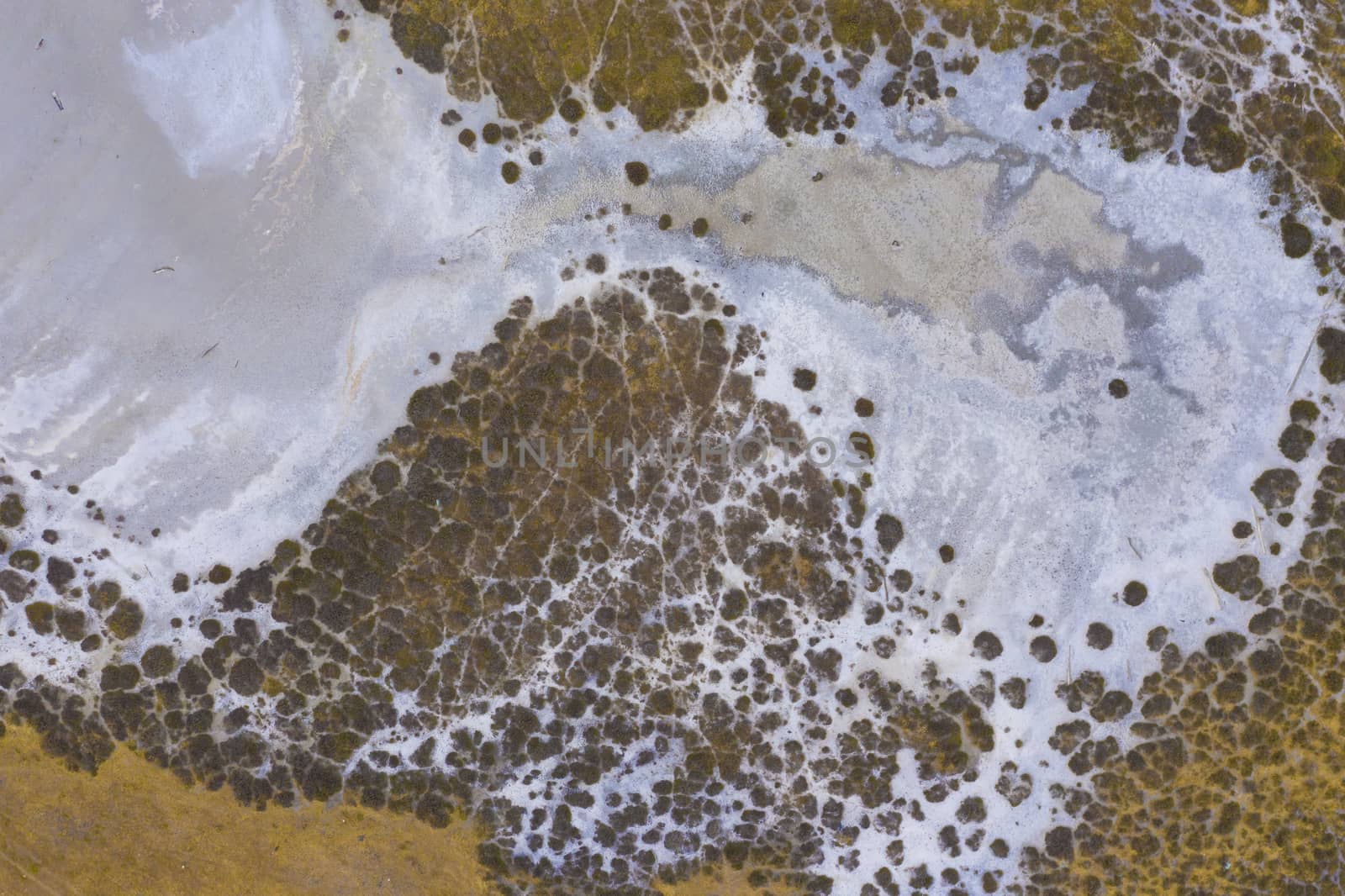 Aerial view of a water reservoir affected by drought in regional Australia by WittkePhotos