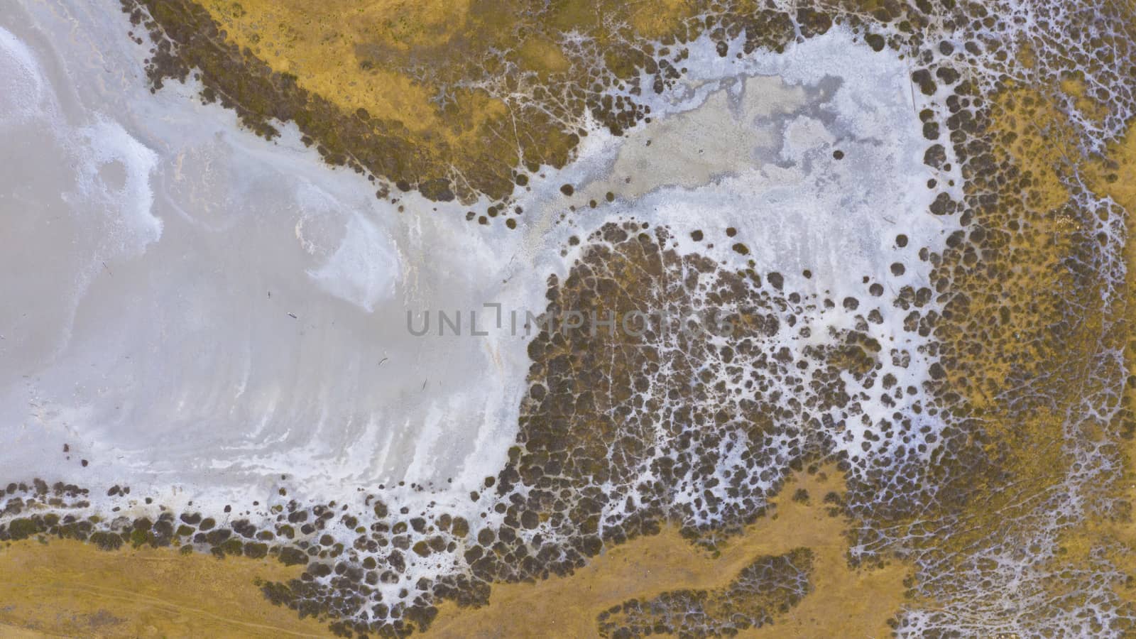 Aerial view of an agricultural irrigation dam affected by drought in regional Australia