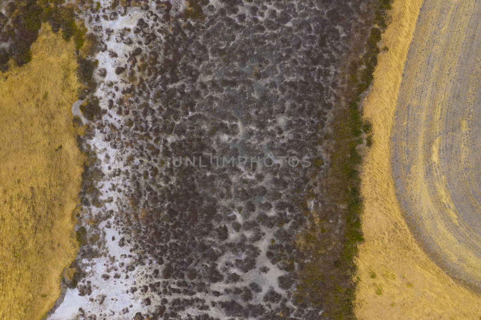 Aerial view of an agricultural irrigation dam affected by drought in regional Australia