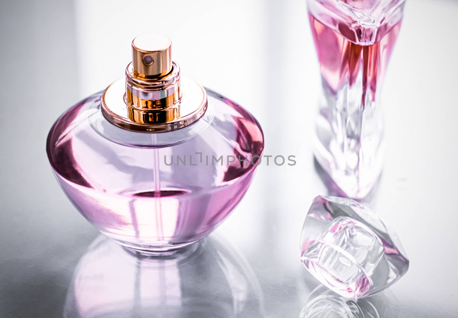 Pink perfume bottle on glossy background, sweet floral scent, gl by Anneleven