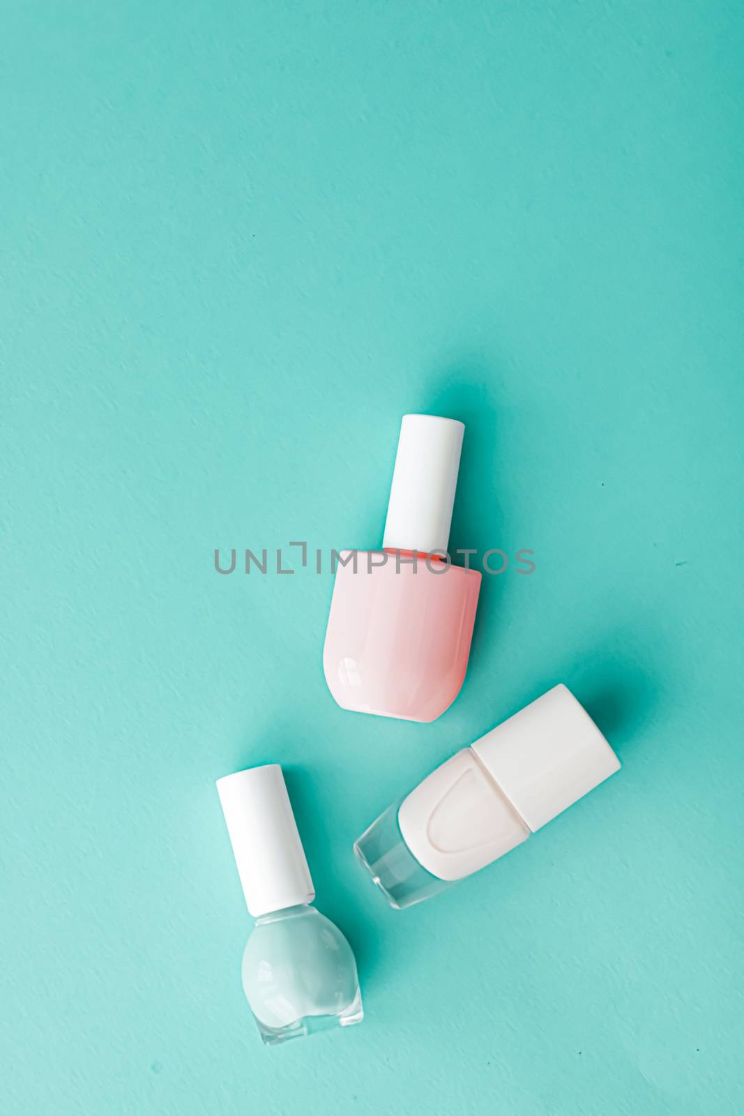 Nail polish bottles on green background, beauty brand by Anneleven