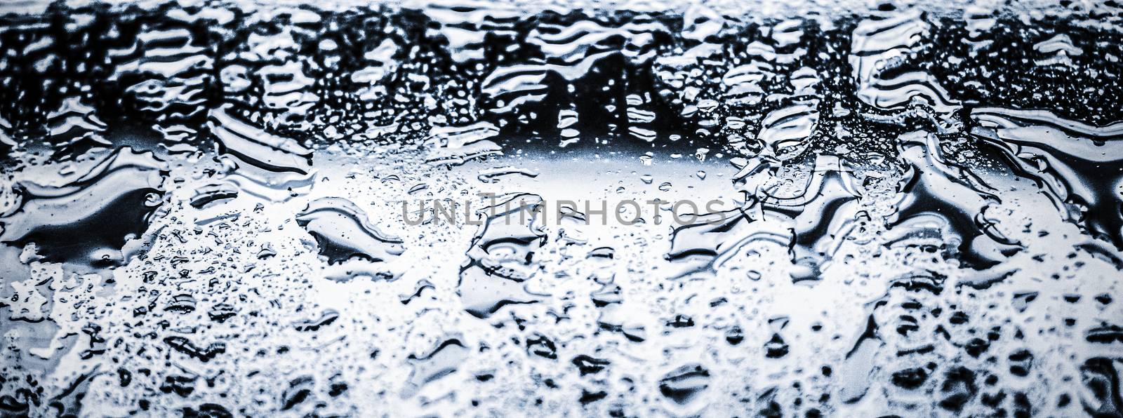 Water texture abstract background, aqua drops on silver glass as by Anneleven