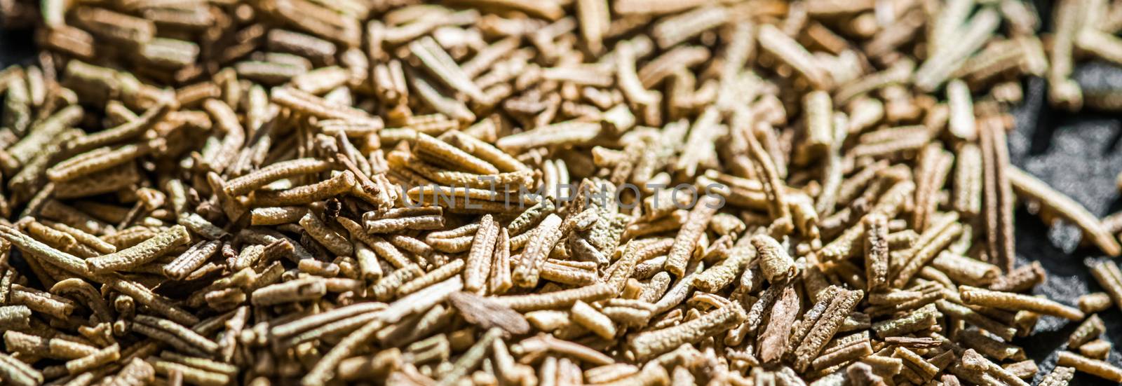 Rosemary closeup on luxury stone background as flat lay, dry food spices and recipe ingredients