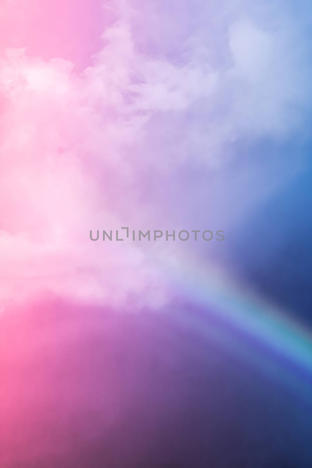 Rainbow in fantasy pink and blue sky, spiritual and nature backgrounds