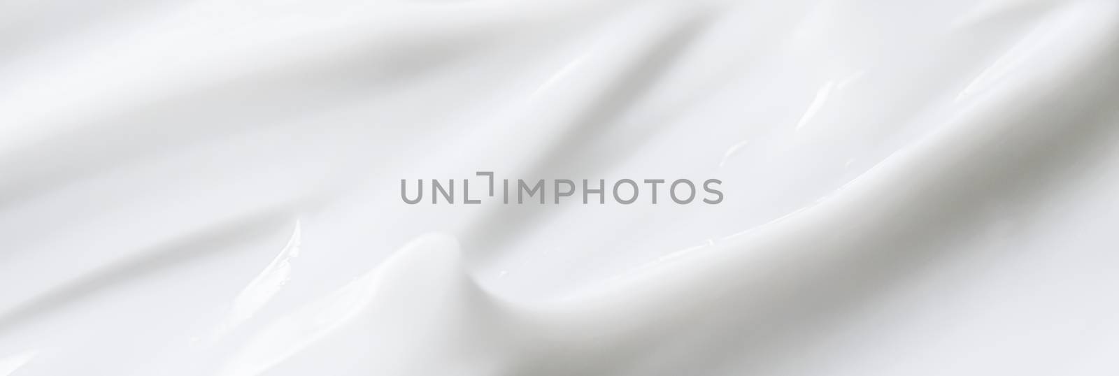 Pure white cream texture as abstract background, food substance or organic cosmetics