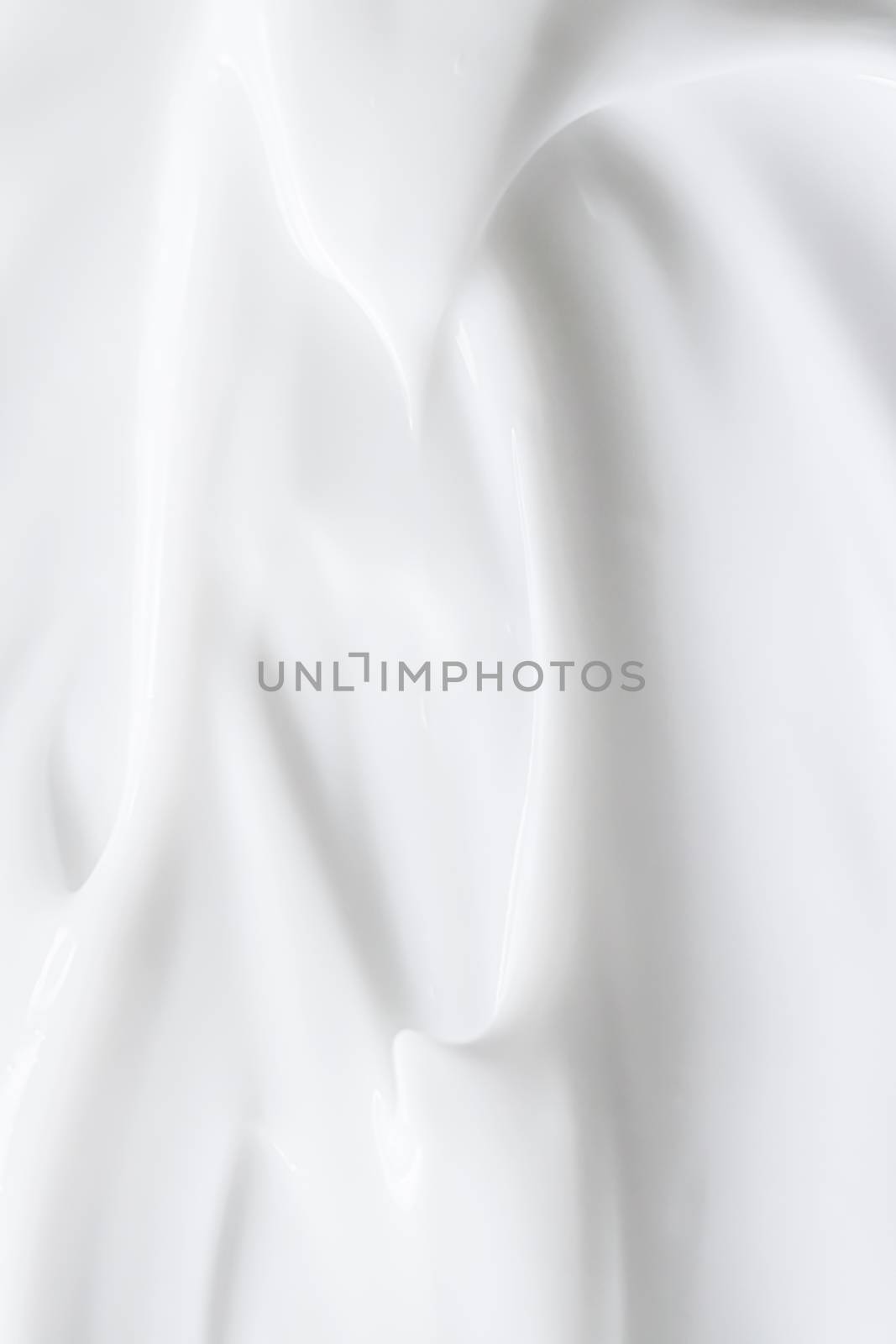 Pure white cream texture as abstract background, food substance or organic cosmetics