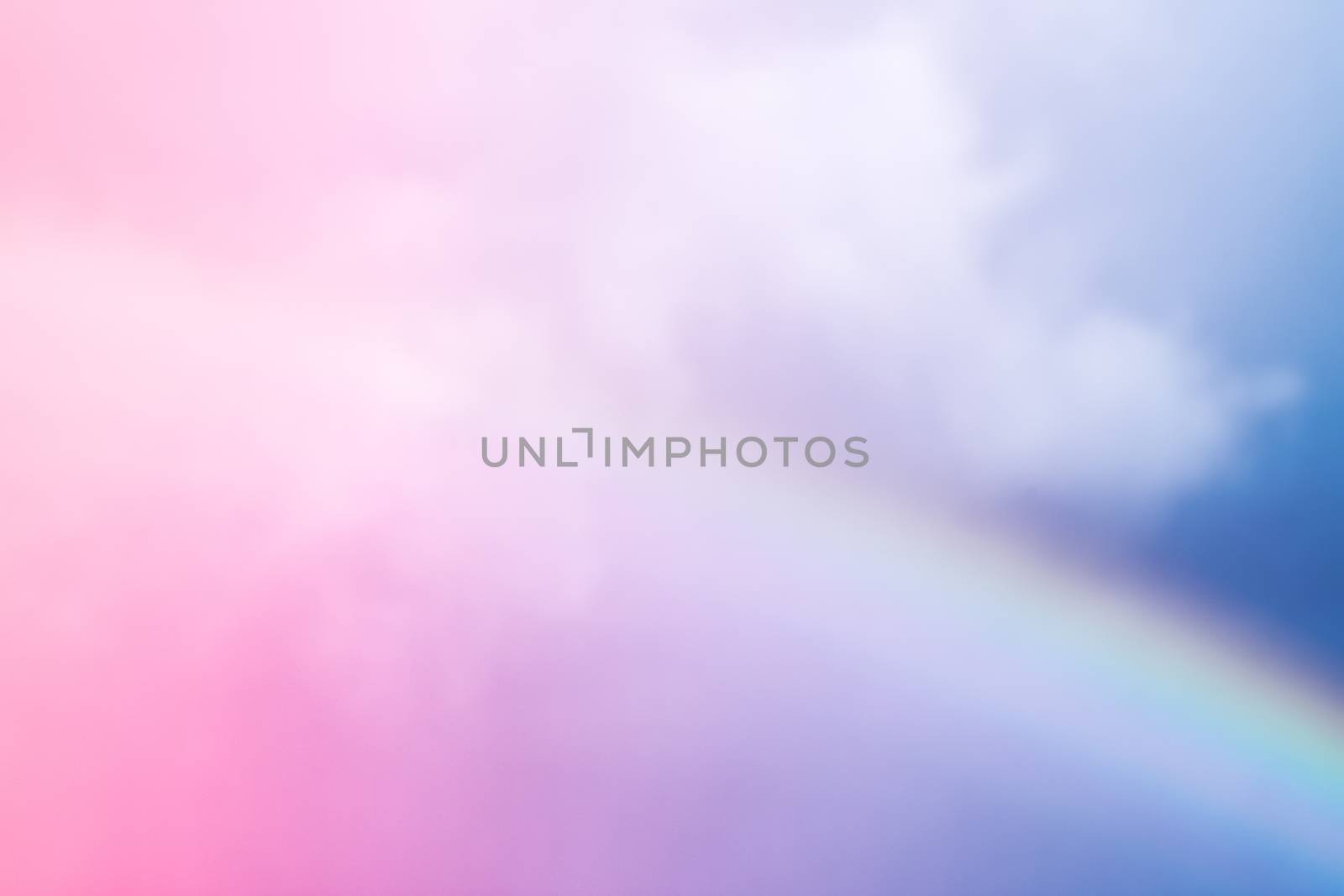 Rainbow in fantasy pink and blue sky, spiritual and nature backgrounds