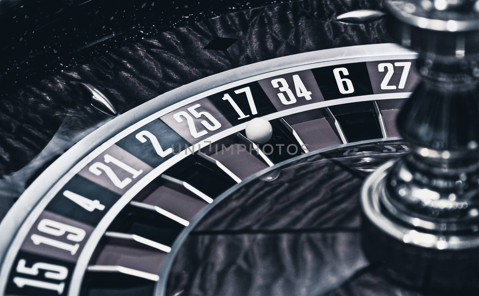 Roulette wheel in casino, gambling ads
