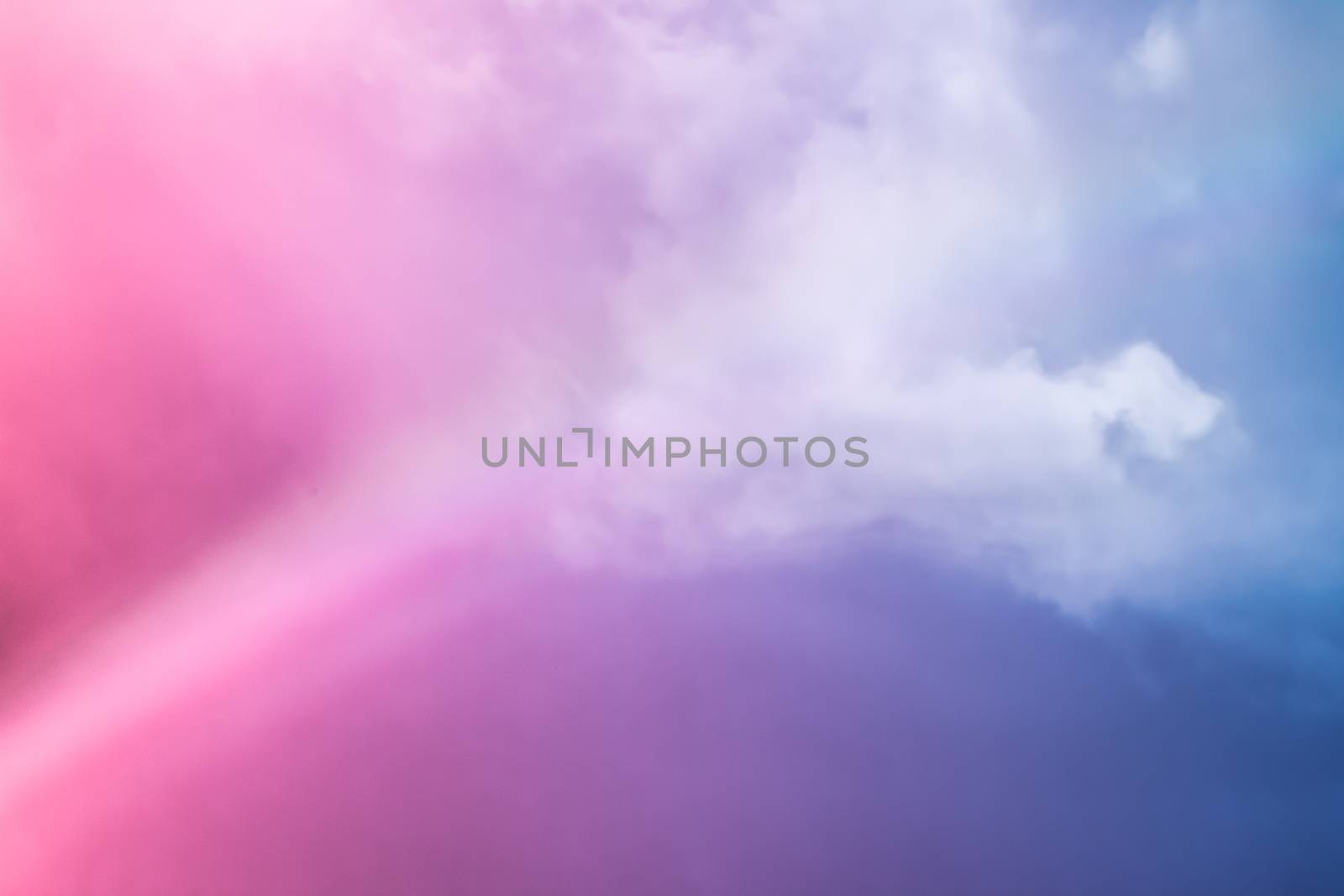 Rainbow in fantasy pink and blue sky, spiritual and nature backgrounds