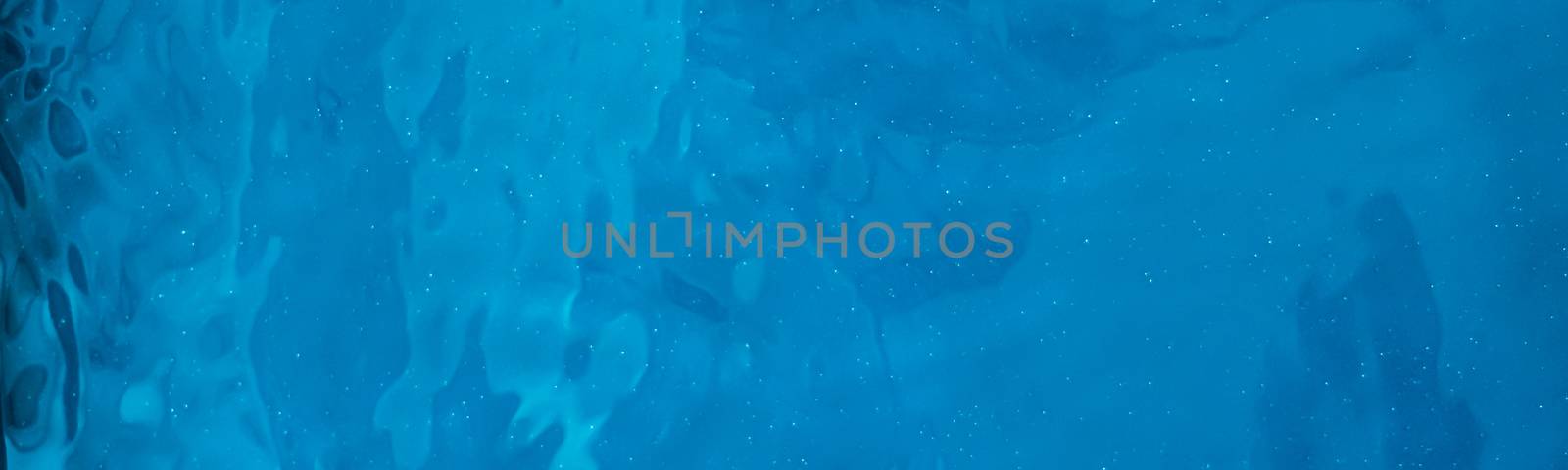 Blue water texture as abstract background, swimming pool and waves designs