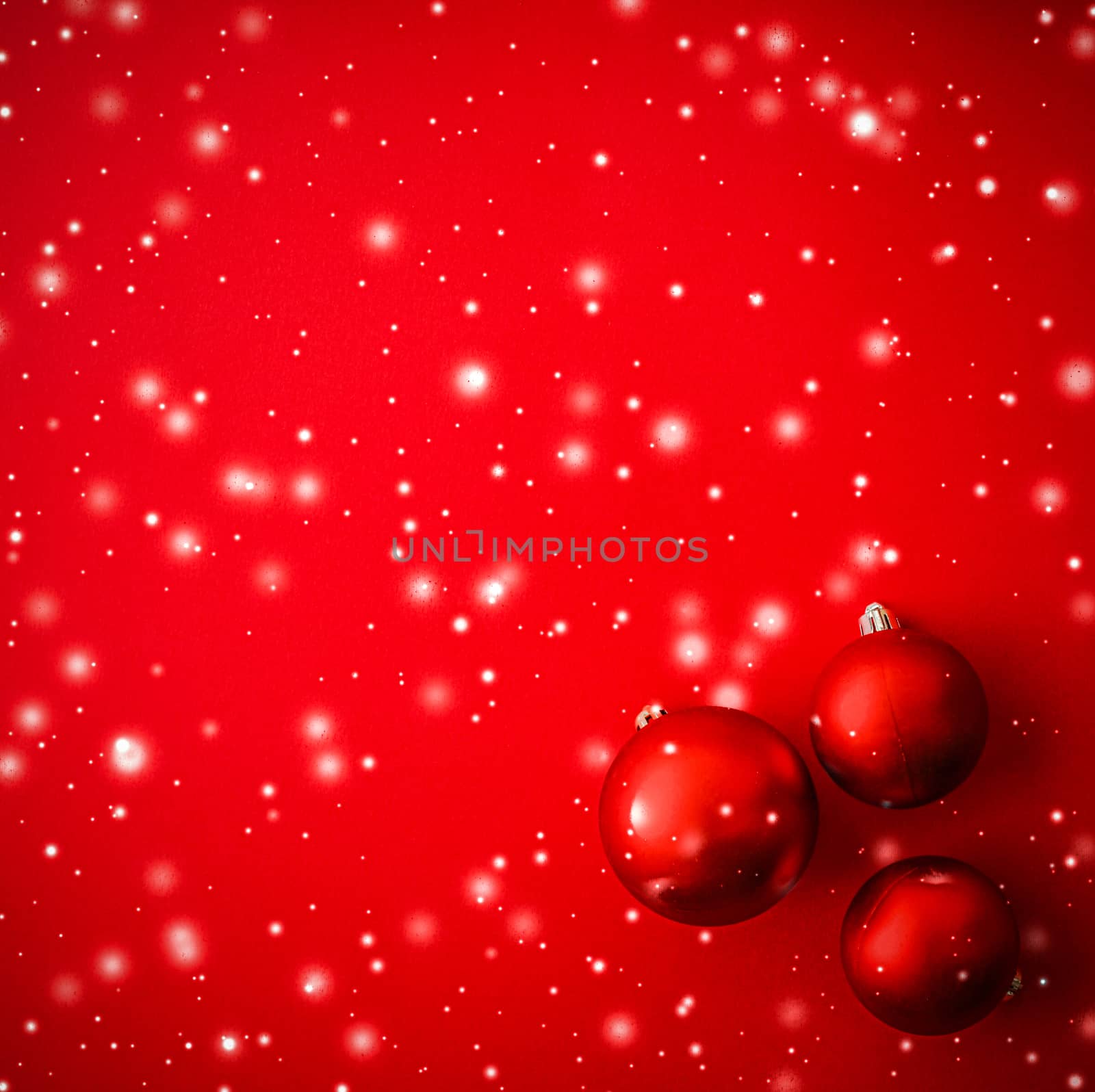 Christmas baubles on red background with snow glitter, luxury wi by Anneleven