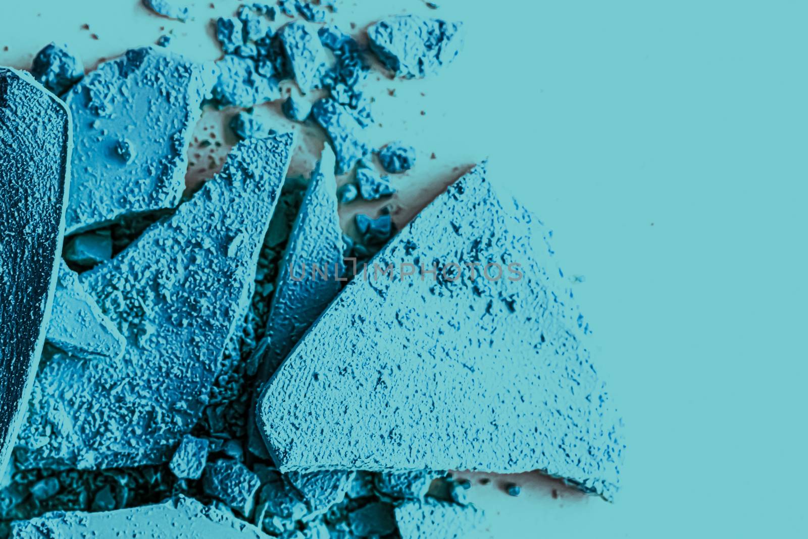 Blue eye shadow powder as makeup palette closeup, crushed cosmetics and beauty textures