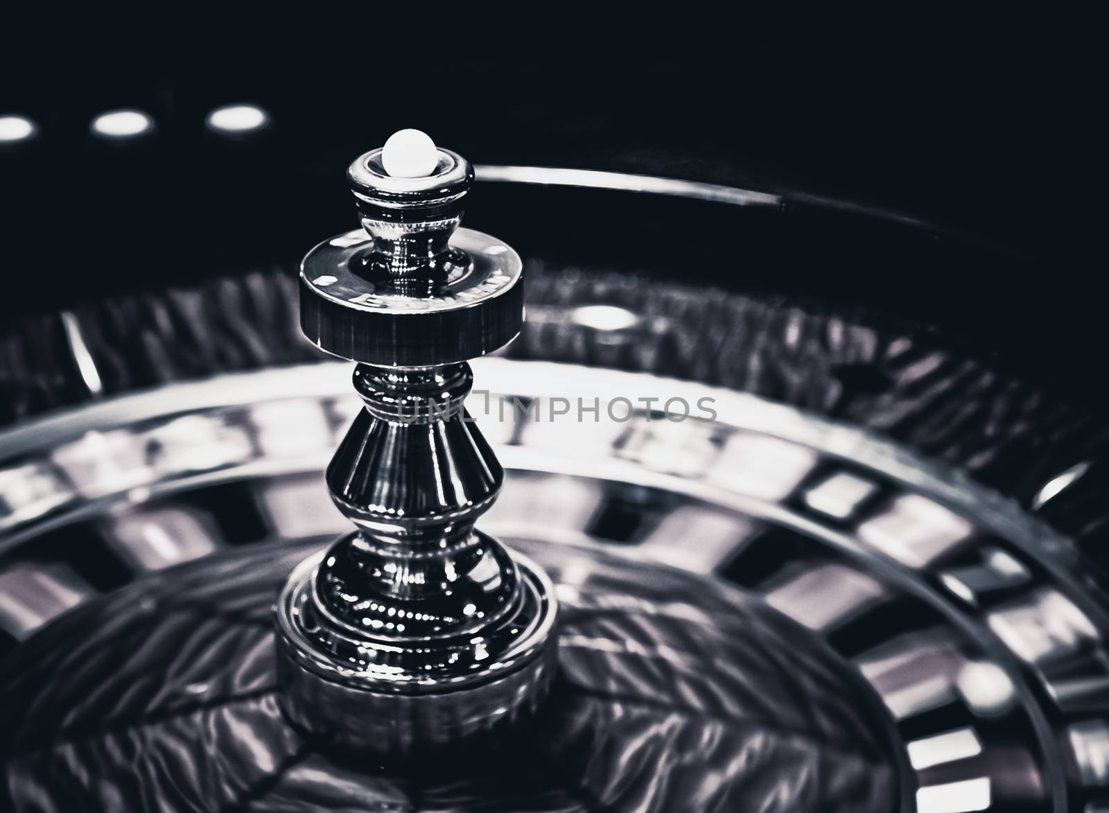 Roulette wheel in casino, gambling ads