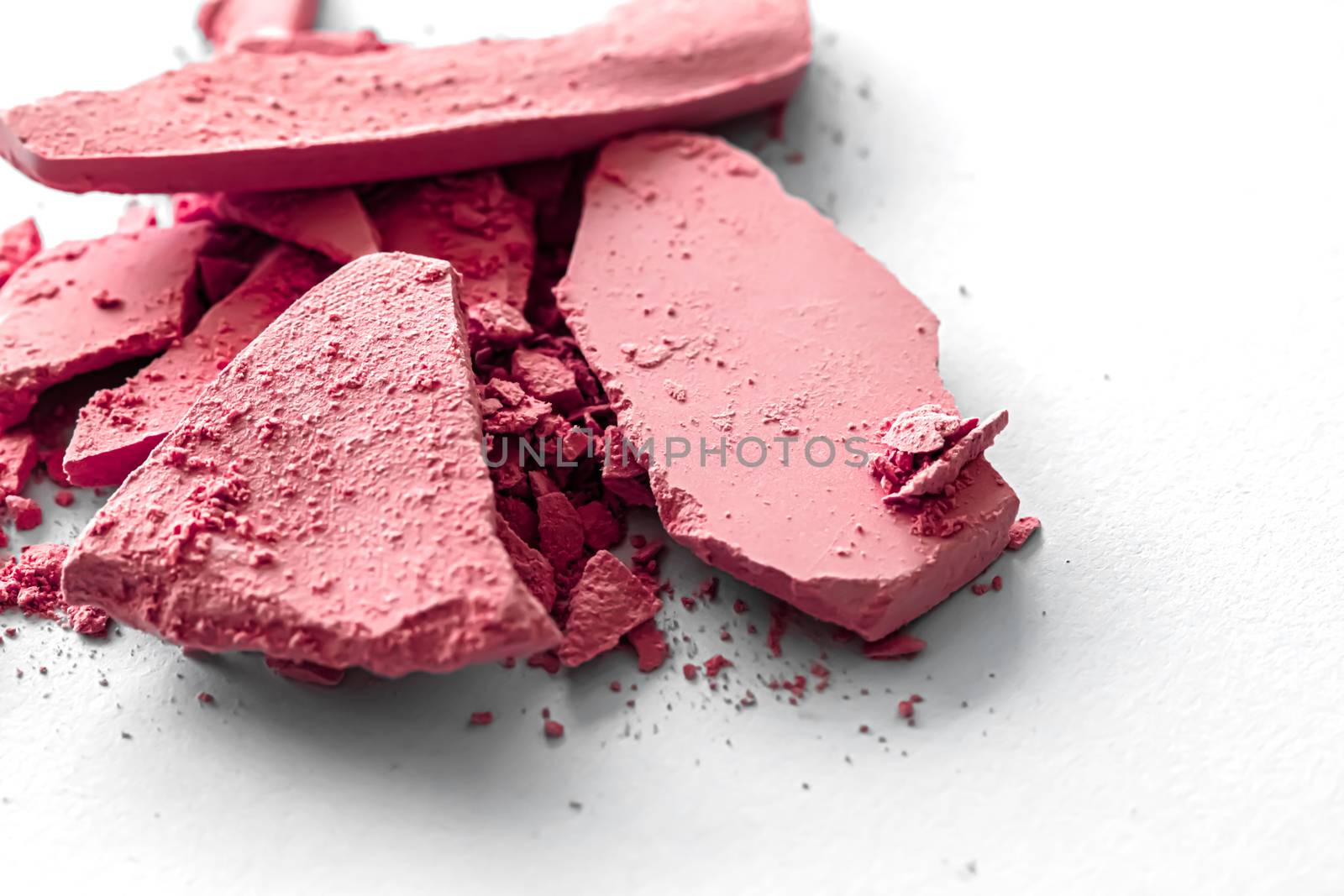 Red eye shadow powder as makeup palette closeup isolated on white background, crushed cosmetics and beauty textures