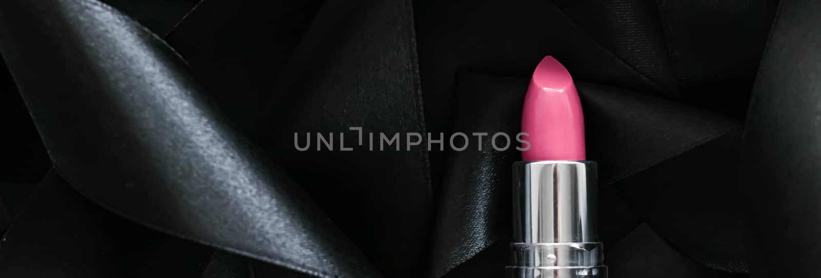 Pink lipstick on black silk background, luxury make-up and beaut by Anneleven