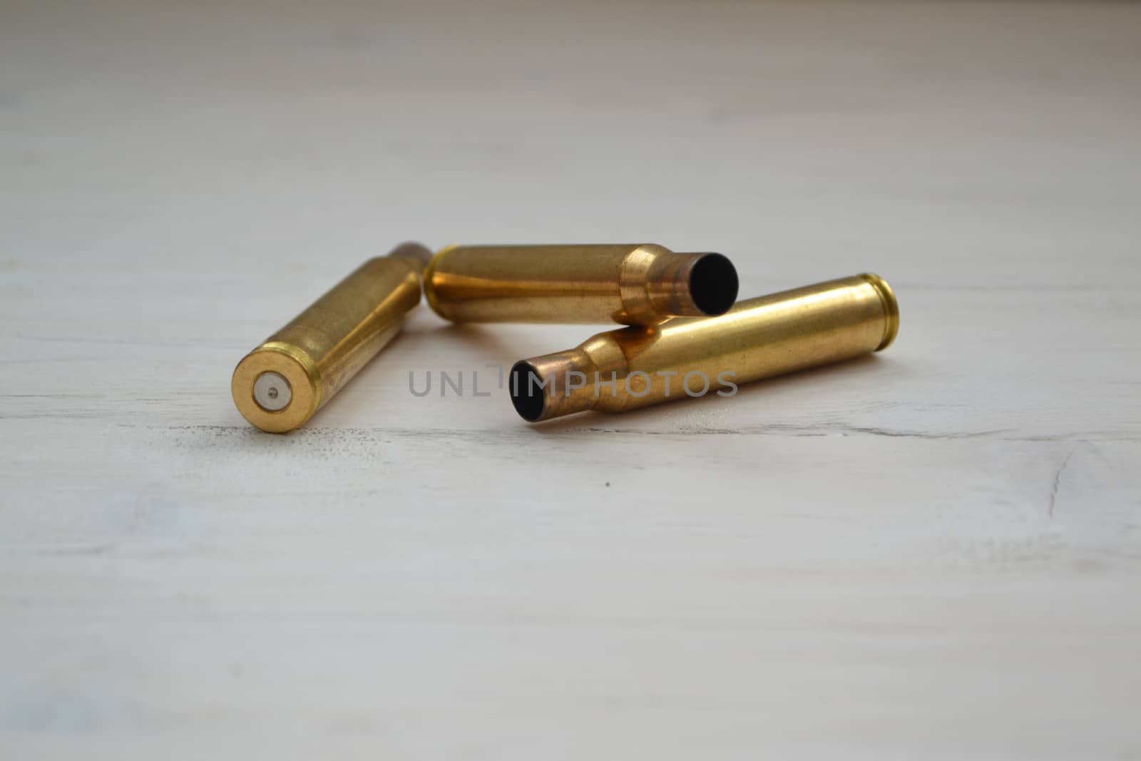 Large bullet macro photo on shabby background