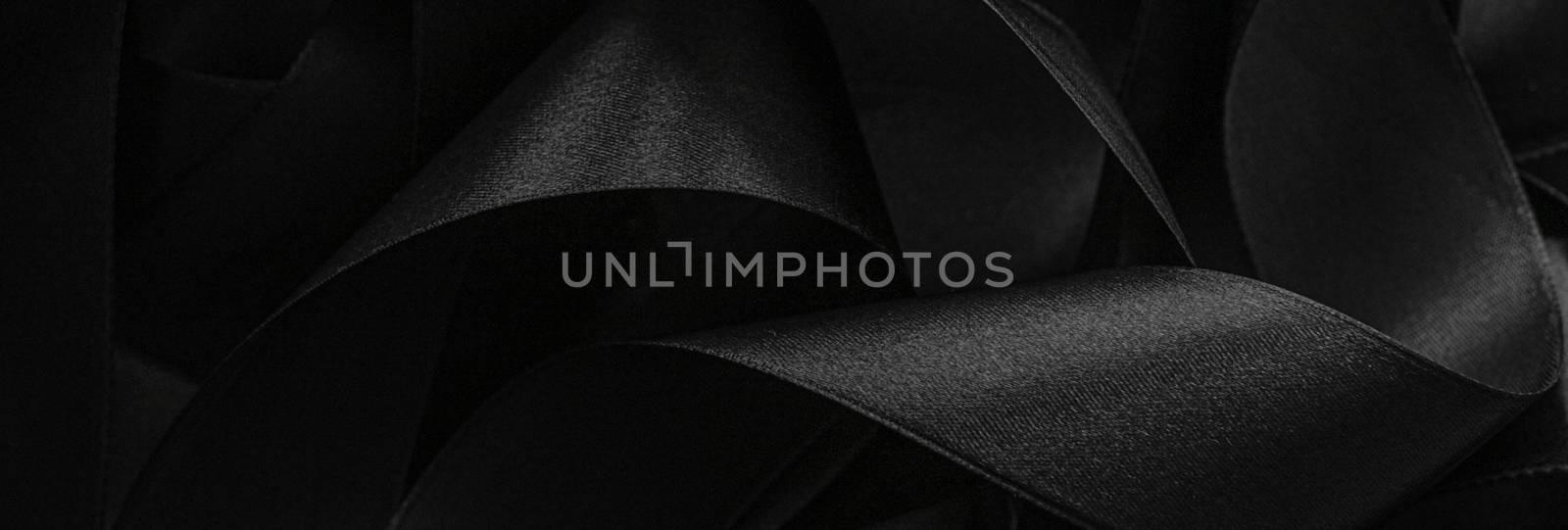 Black silk ribbon as background, abstract and luxury brand desig by Anneleven