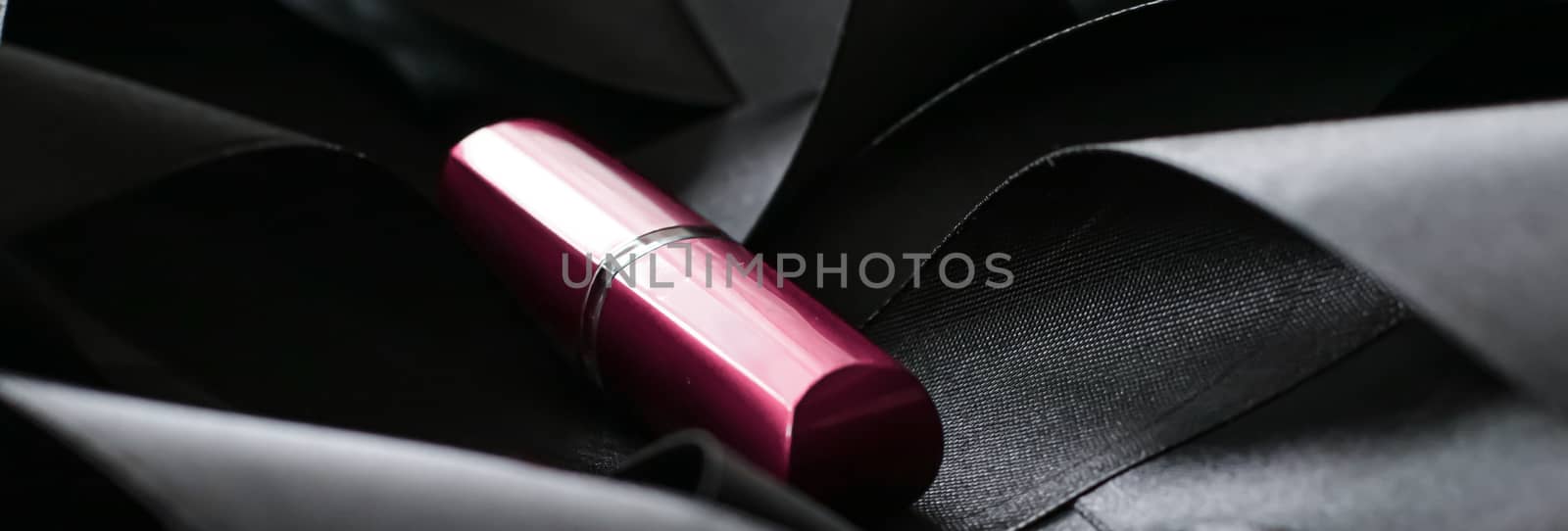 Pink lipstick on black silk background, luxury make-up and beaut by Anneleven