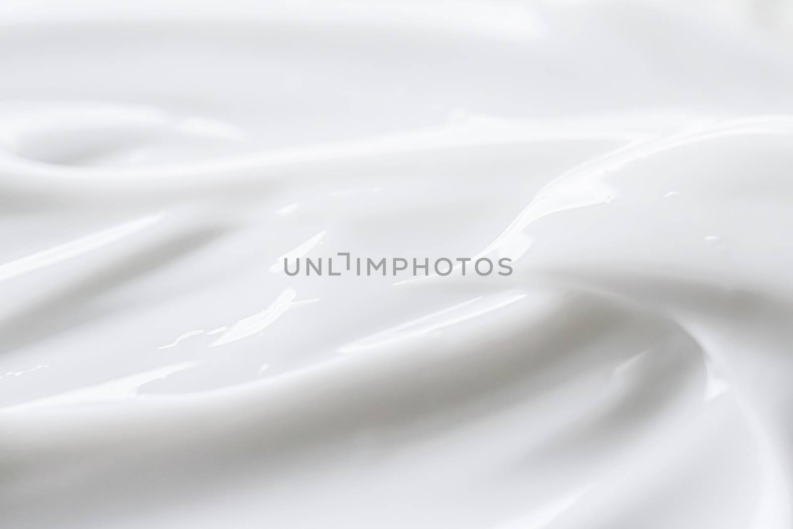 Pure white cream texture as abstract background, food substance or organic cosmetics