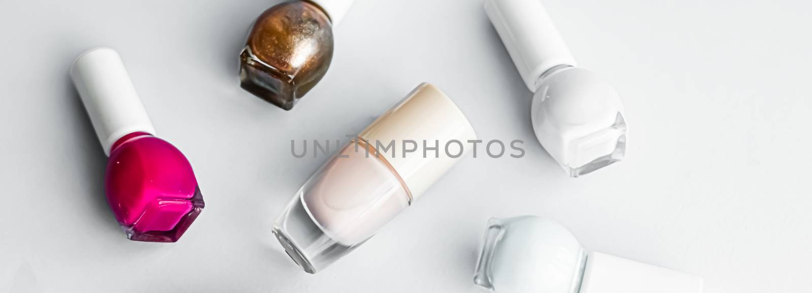 Nail polish bottles on white background, beauty brand by Anneleven