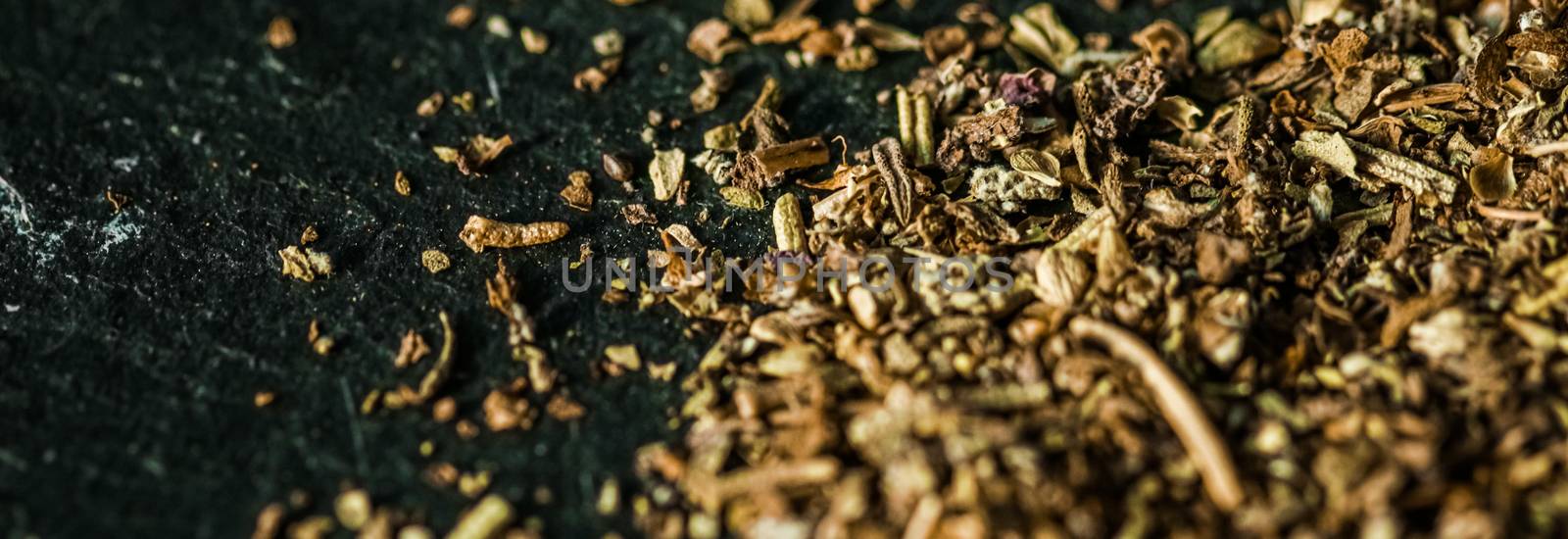 Provencal spices mix closeup on luxury stone background as flat lay, dry food spices and recipe ingredients