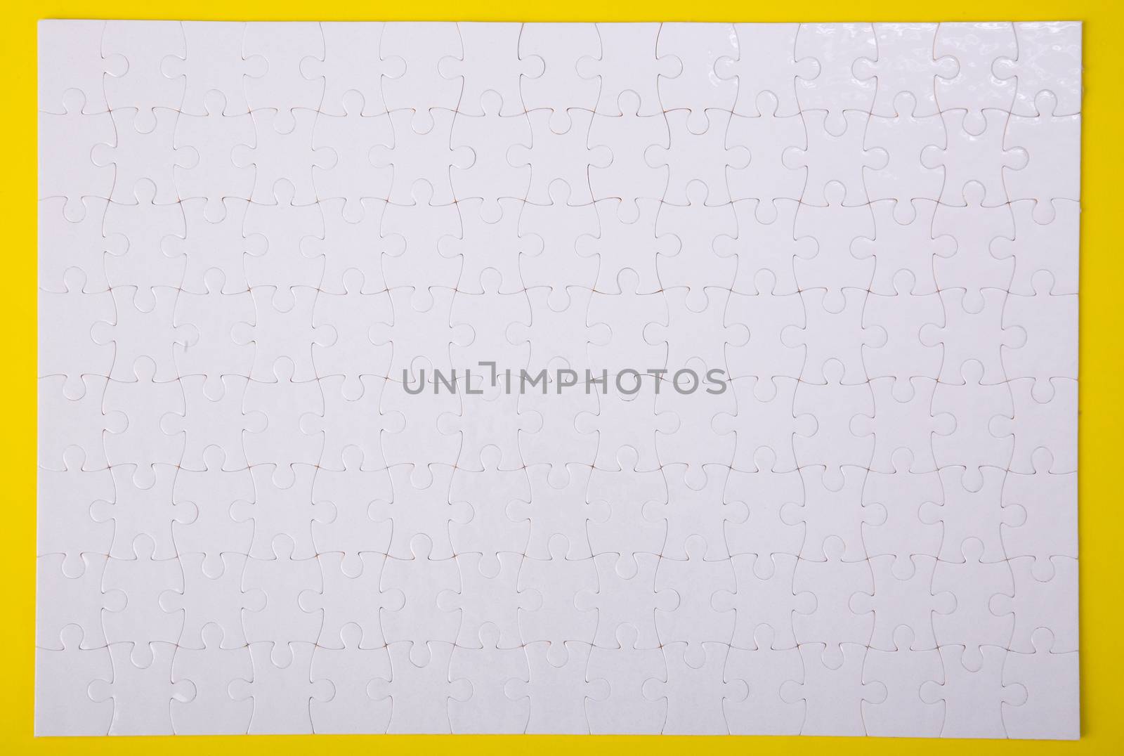 White jigsaw puzzle pattern background. jigsaw puzzle
