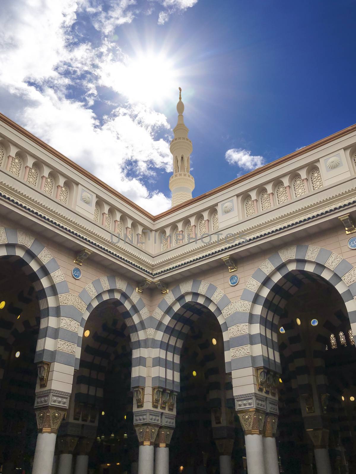 Madinah, Saudi Arabia - July 07, 2020: View of cloudy blue sky at Nabawi Mosque or Prophet Mosque in Madinah, Saudi Arabia. Selective focus