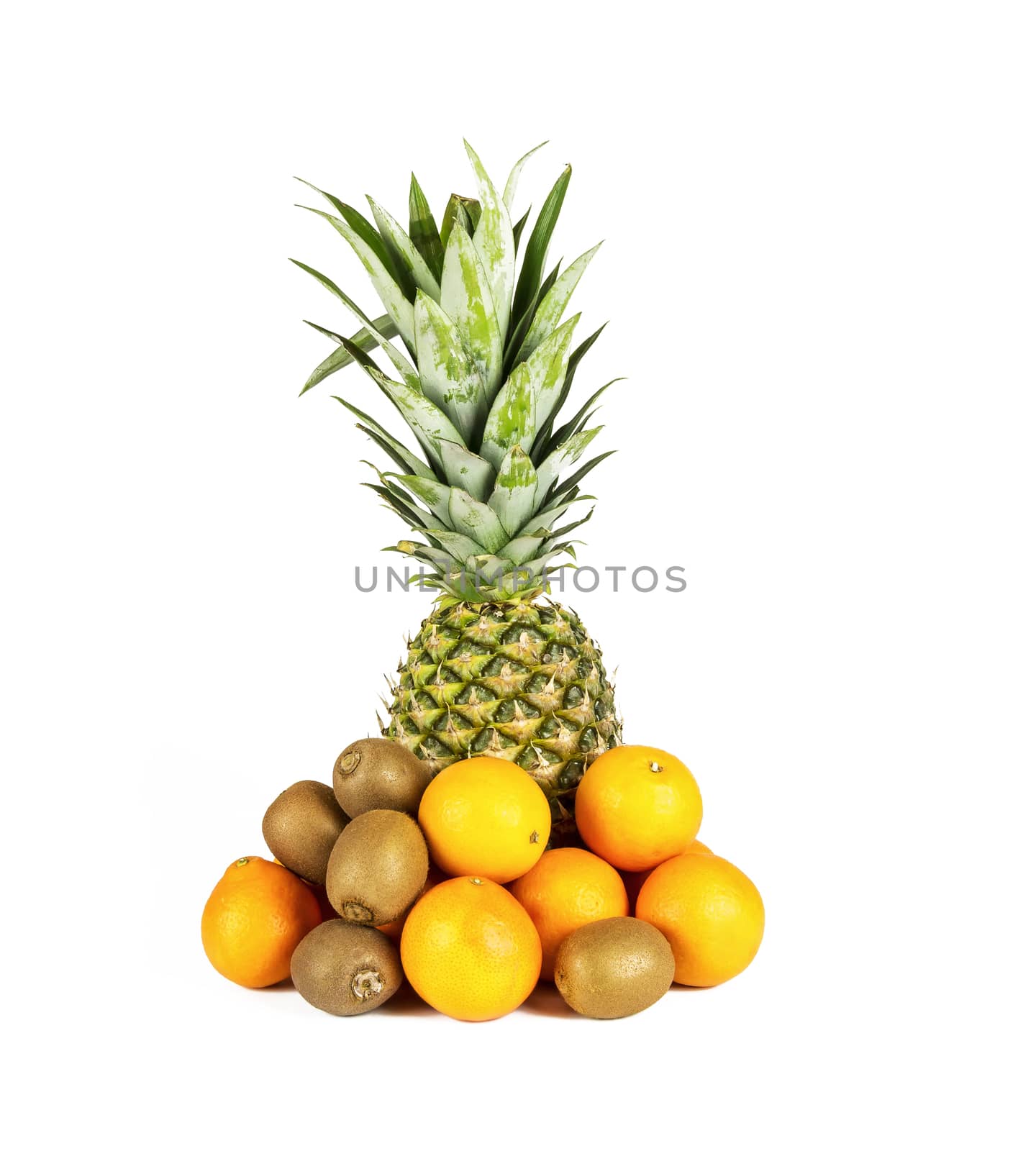 On a white background there is a large ripe pineapple and near lie kiwi with mandarins
 