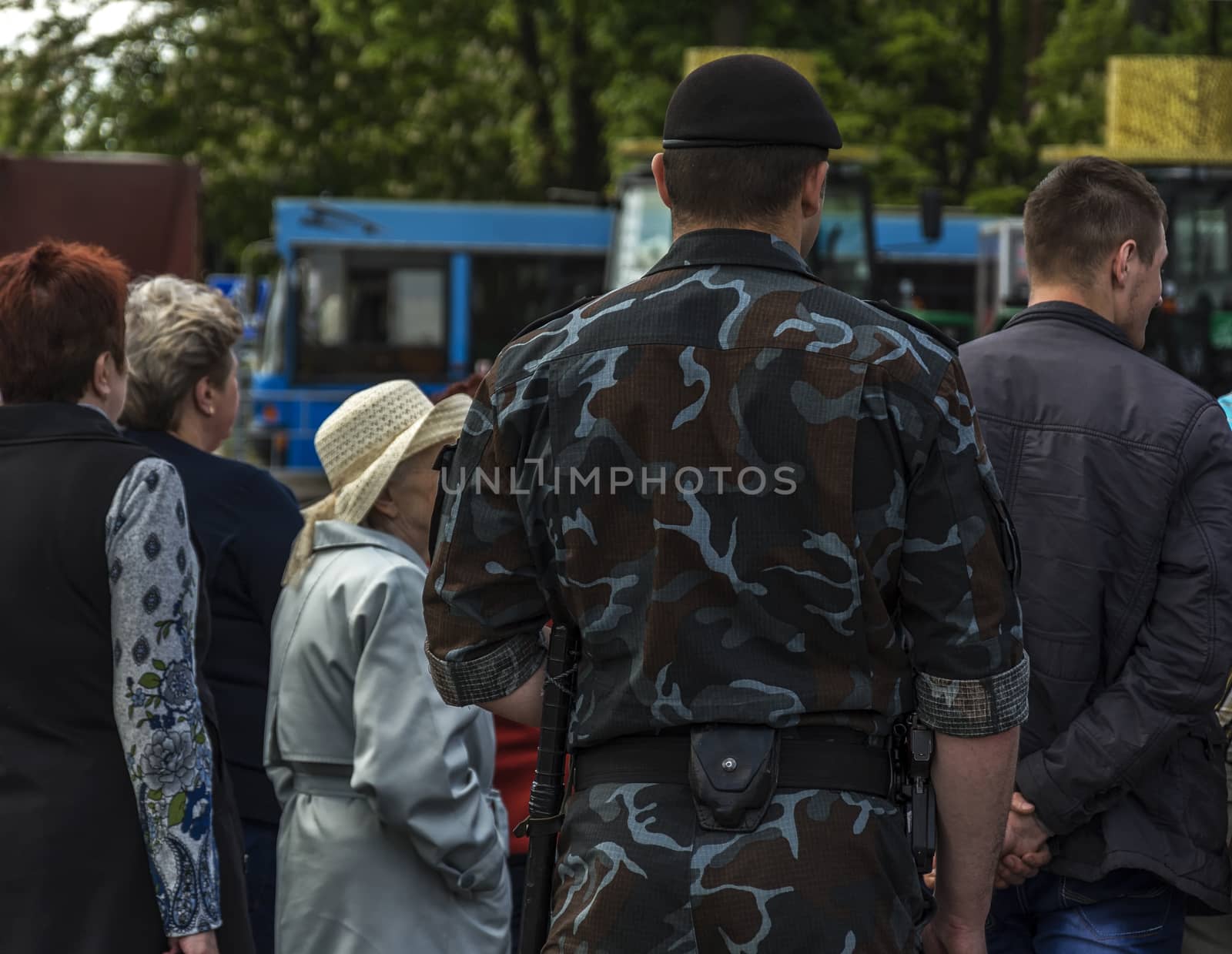 Belarus, Minsk - 05/27/2017 - The back of a man in uniform camouflage clothes and beret