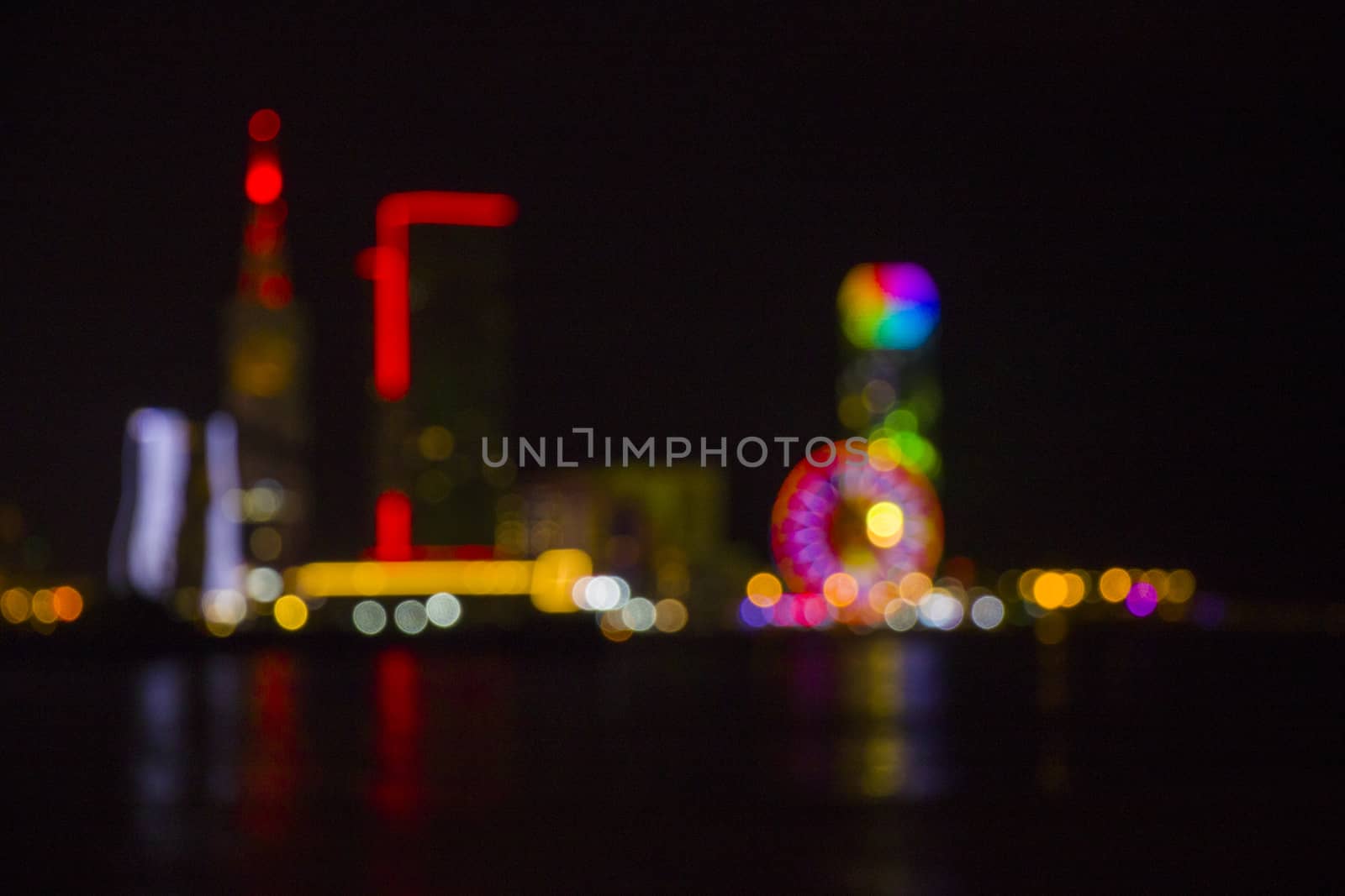 Batumi at night city view, unfocused and blur photo of skyscrapers and towers. City view at night. by Taidundua