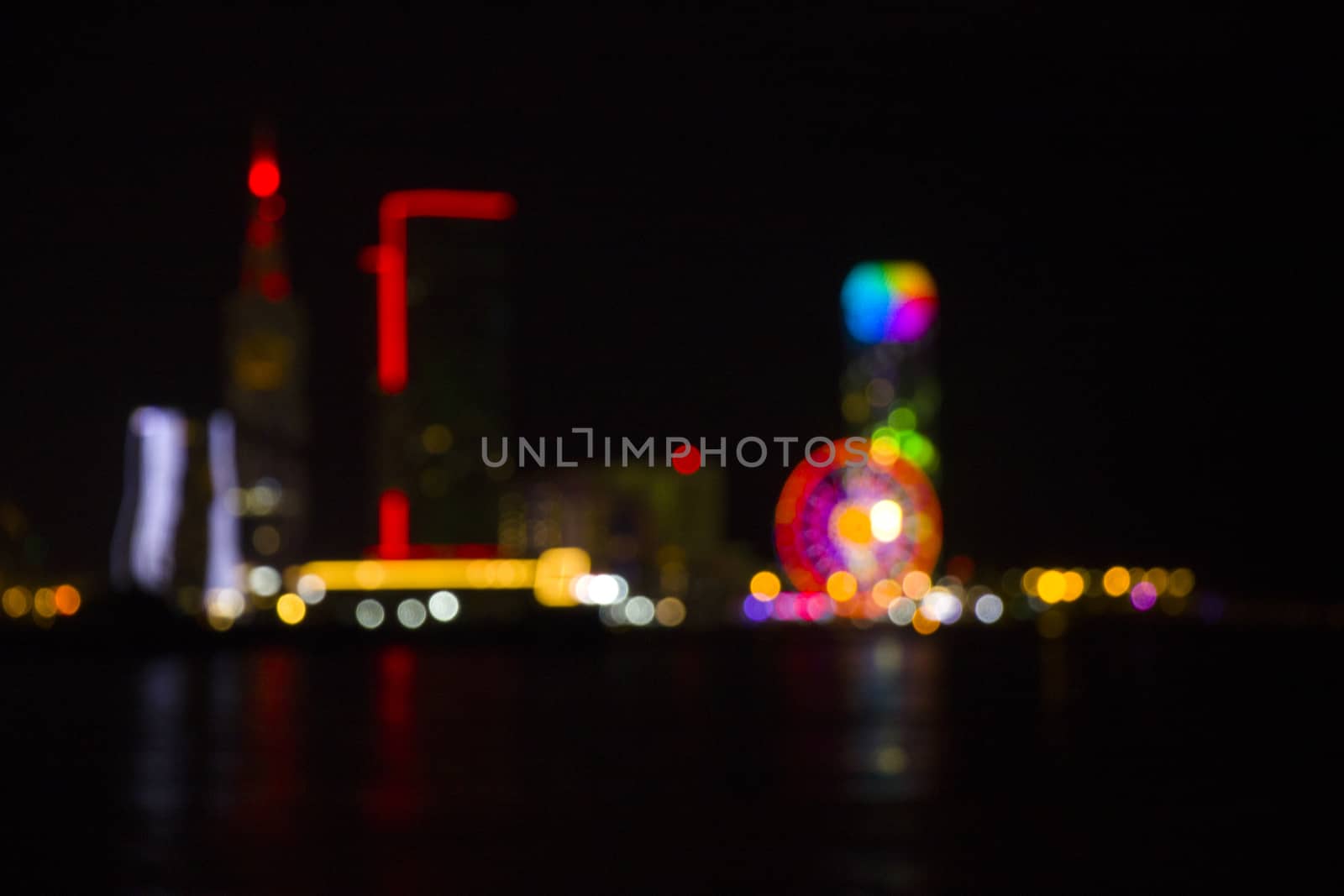 Batumi at night city view, unfocused and blur photo of skyscrapers and towers. City view at night. Most amazing view of the city in Georgia.