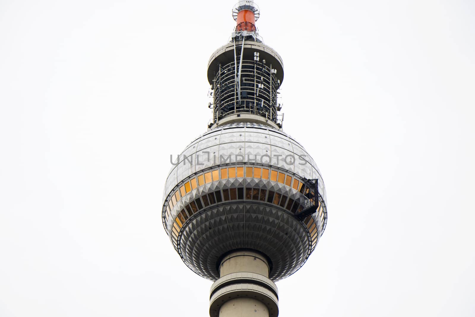 TV tower famous landmark and architecture in Berlin, Germany, white sky.