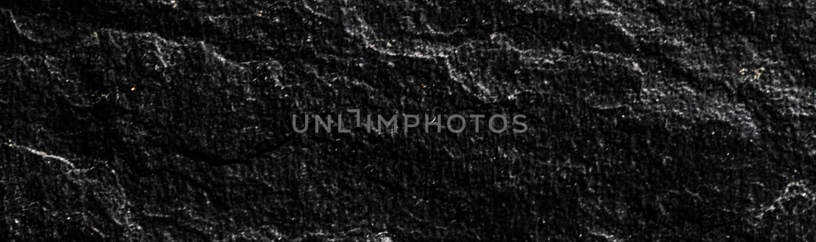 Black stone texture as abstract background, design material and textured surfaces