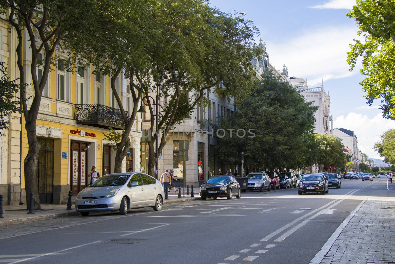Tbilisi city center, street situation, people, cars and buildings. by Taidundua
