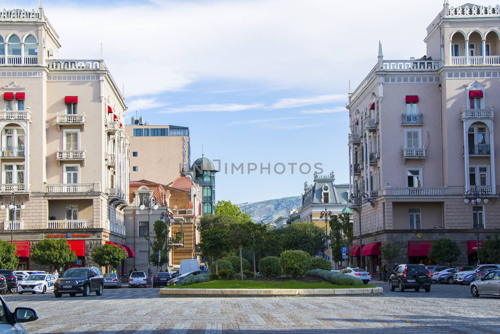 Tbilisi city center, street situation, people, cars and buildings. by Taidundua