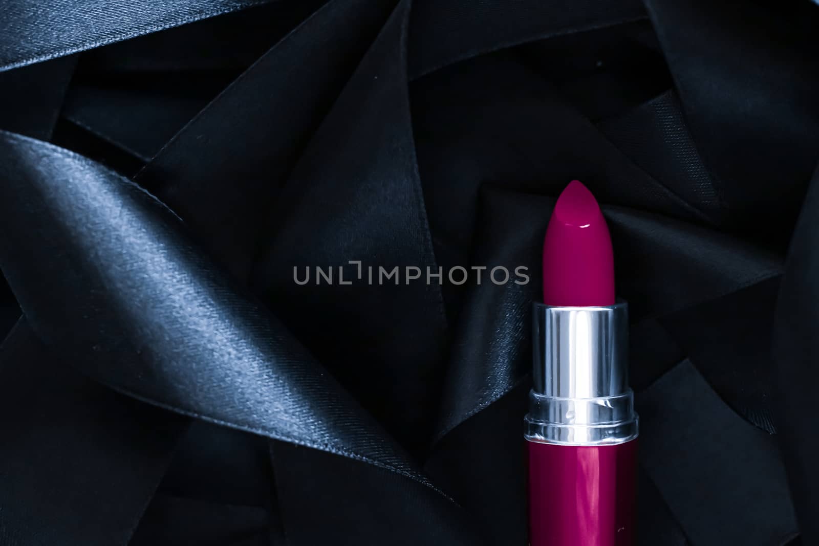 Purple lipstick on black silk background, luxury make-up and bea by Anneleven