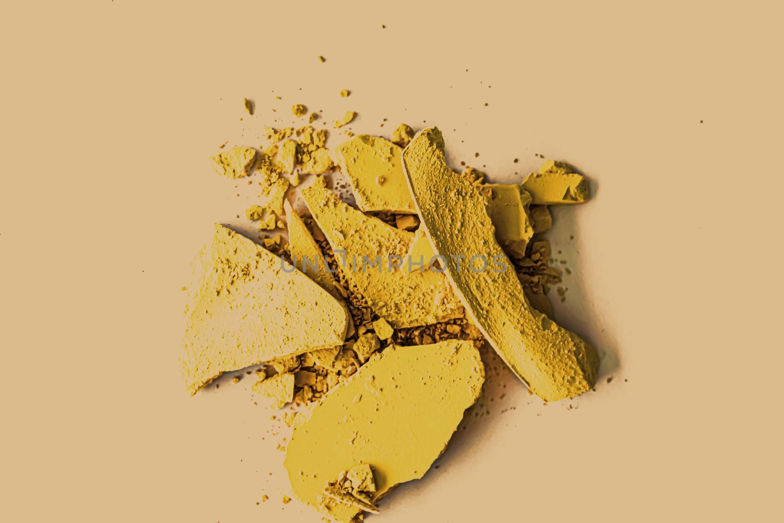 Yellow eye shadow powder as makeup palette closeup, crushed cosm by Anneleven