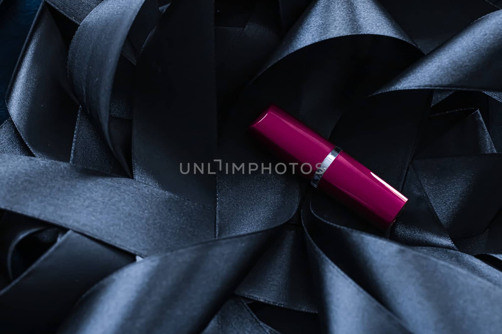 Purple lipstick on black silk background, luxury make-up and bea by Anneleven