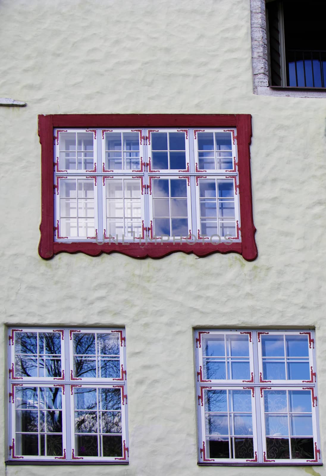 Buildings and architecture exterior view in old town of Tallinn, colorful old style house window. by Taidundua