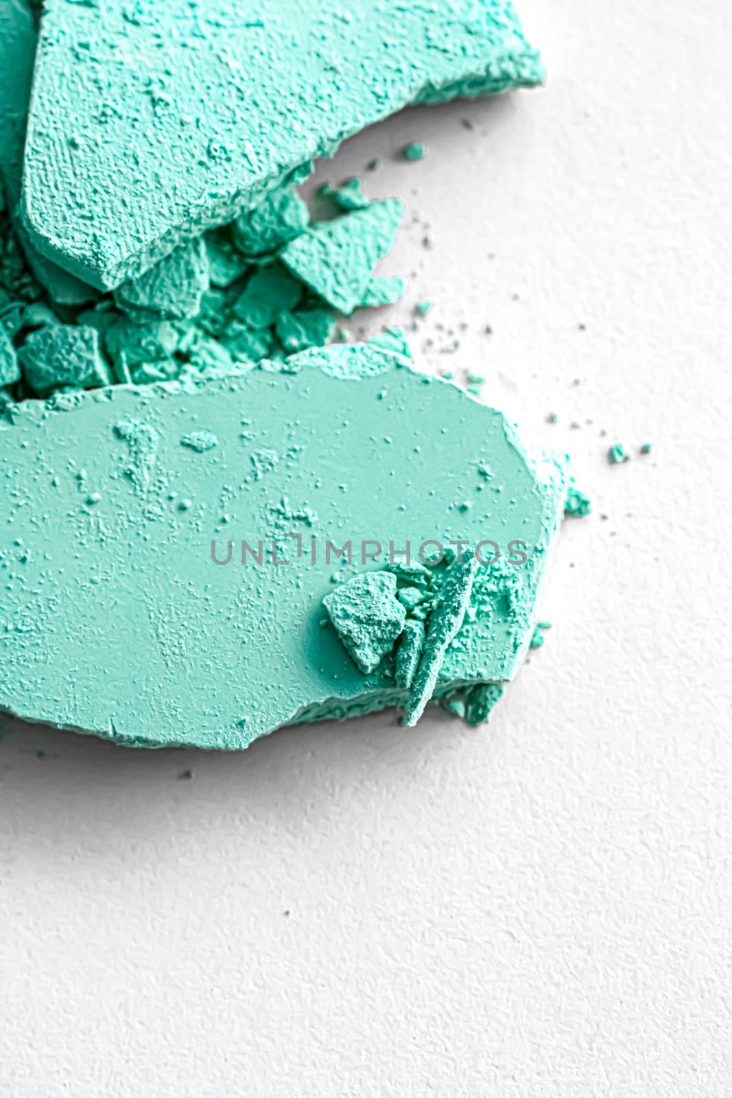 Mint eye shadow powder as makeup palette closeup isolated on white background, crushed cosmetics and beauty textures