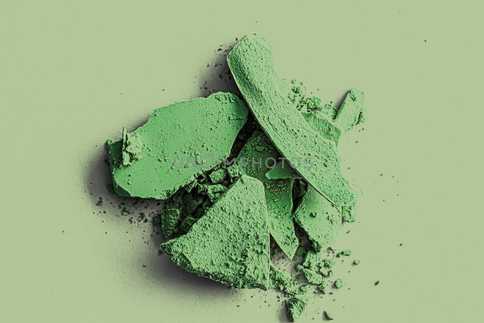 Green eye shadow powder as makeup palette closeup, crushed cosme by Anneleven