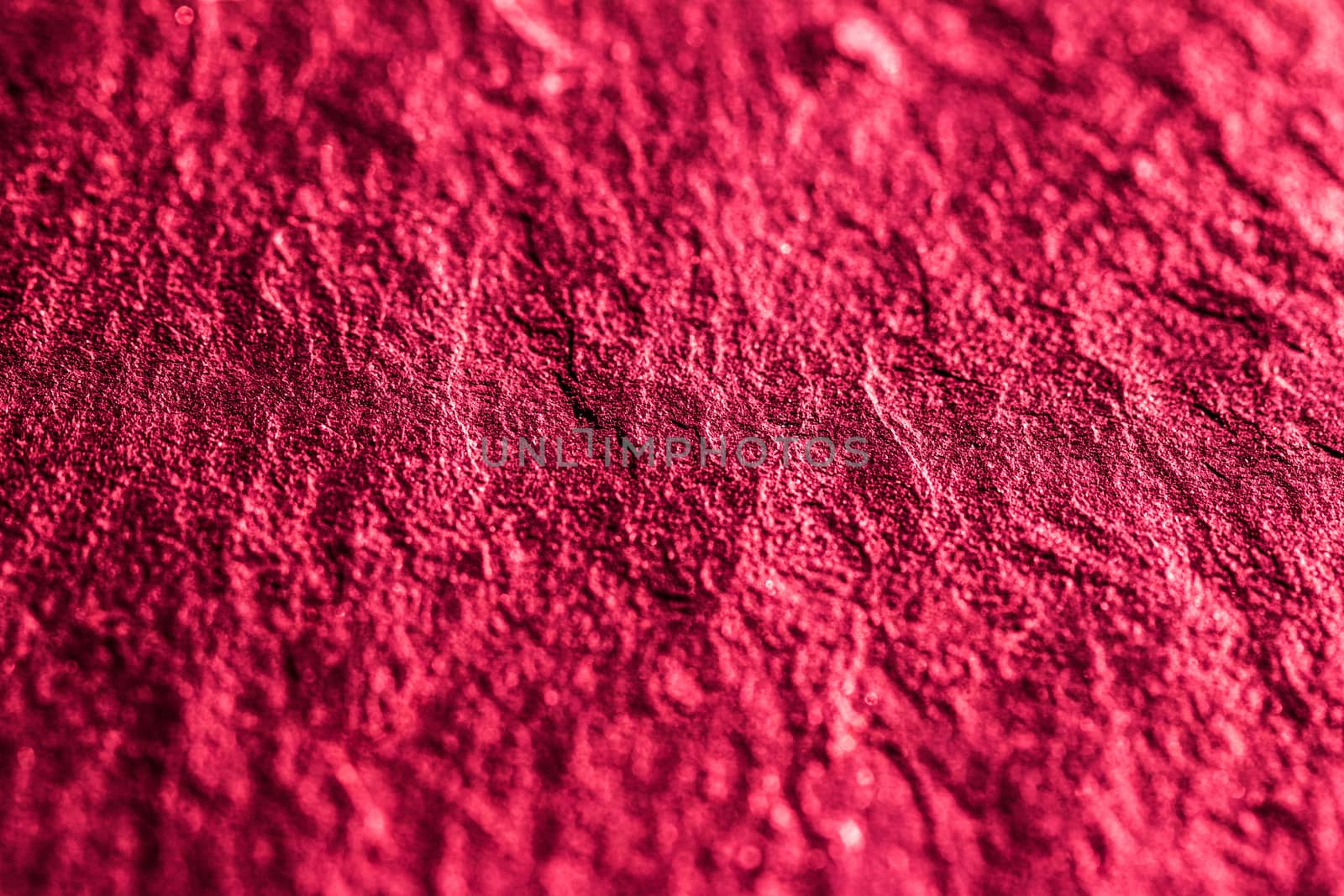 Red stone texture as abstract background, design material and textured surfaces