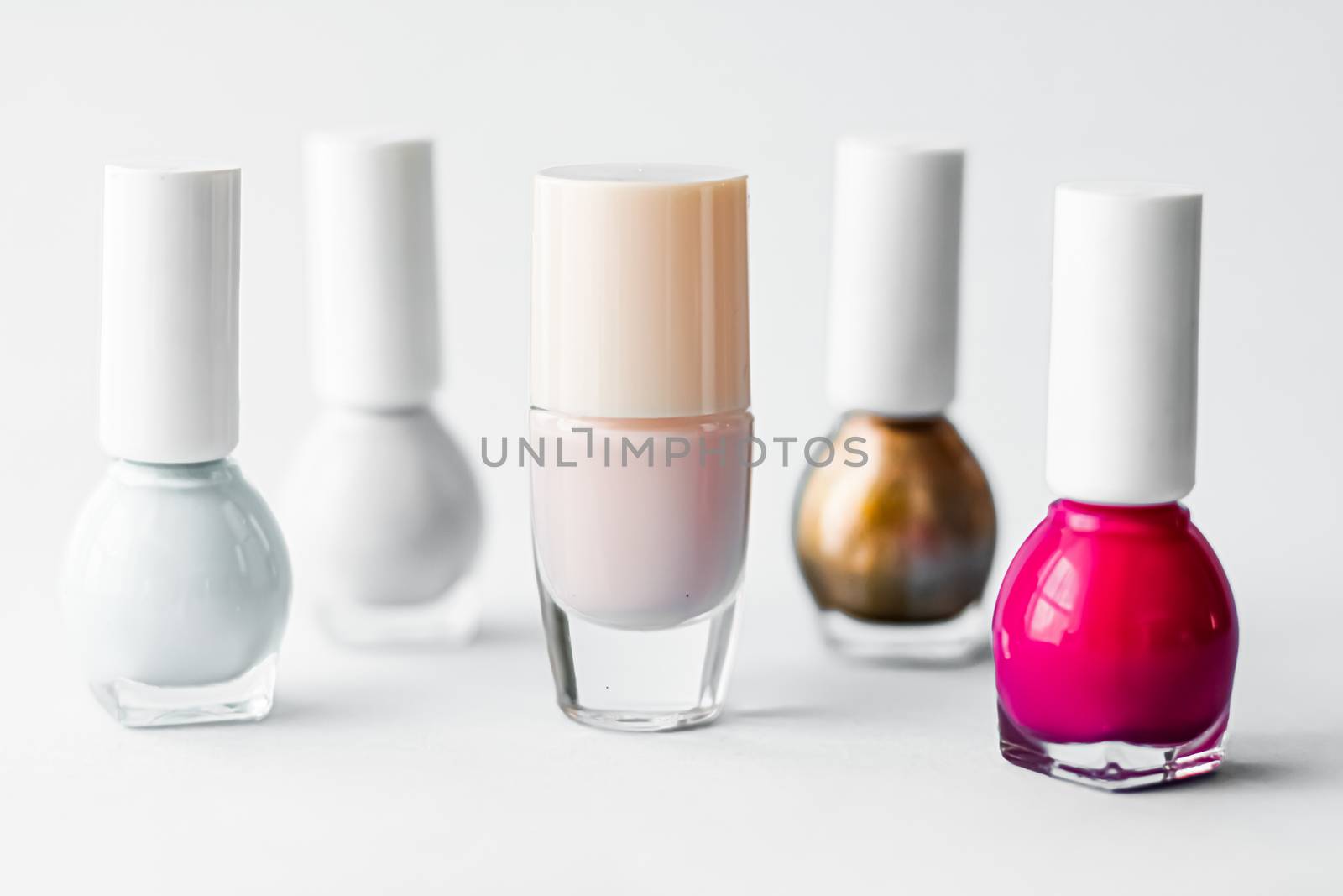 Nail polish bottles on white background, beauty brand by Anneleven