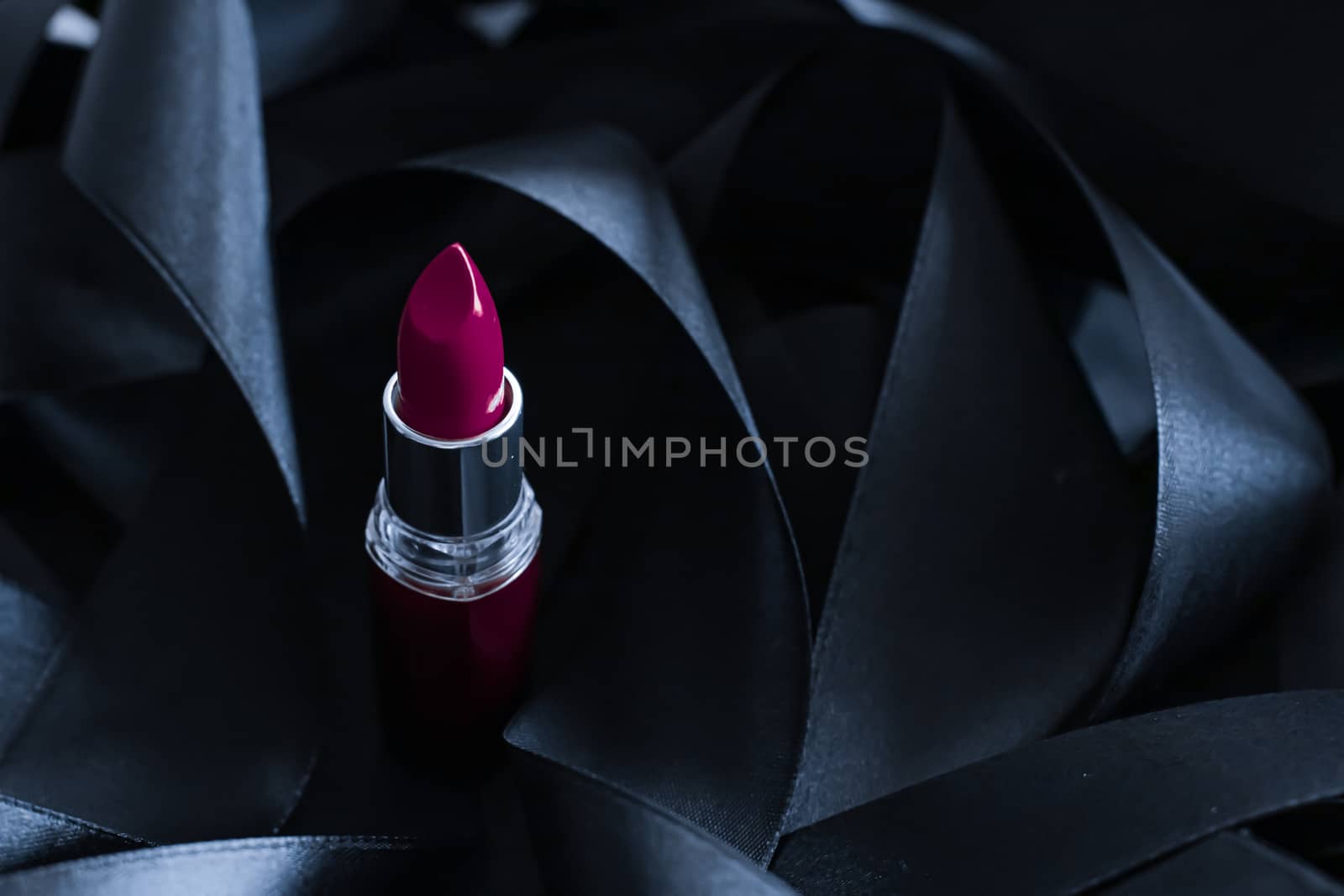 Purple lipstick on black silk background, luxury make-up and bea by Anneleven