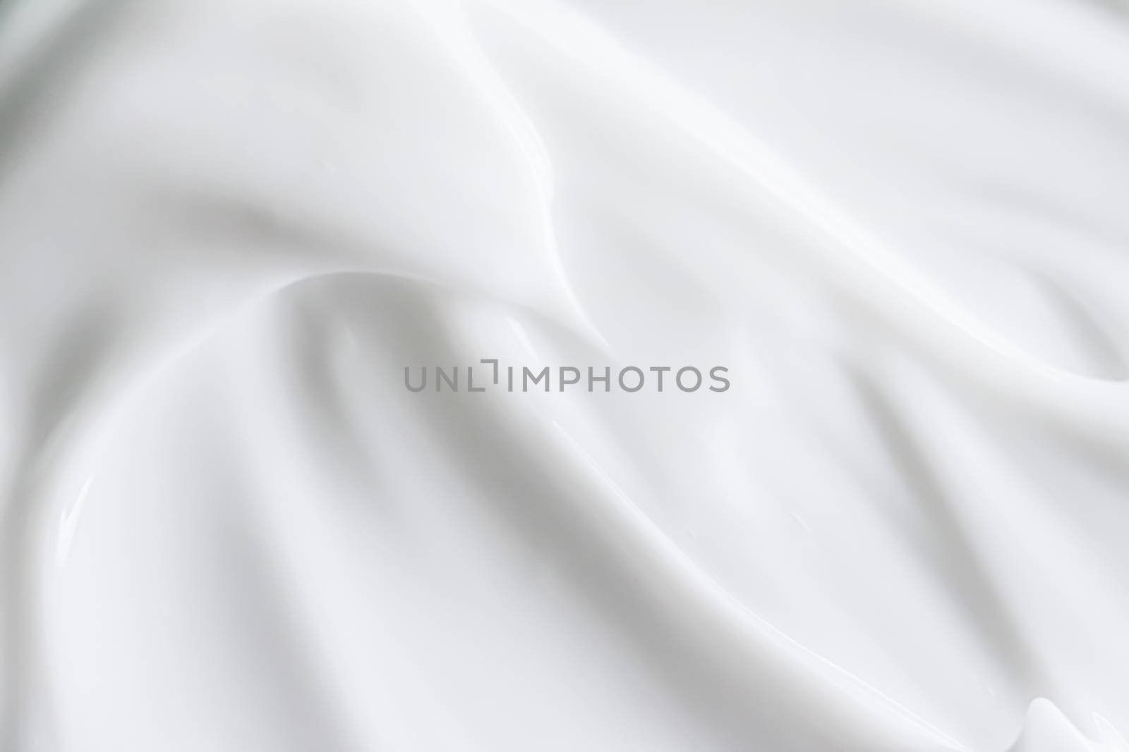 Pure white cream texture as abstract background, food substance or organic cosmetics