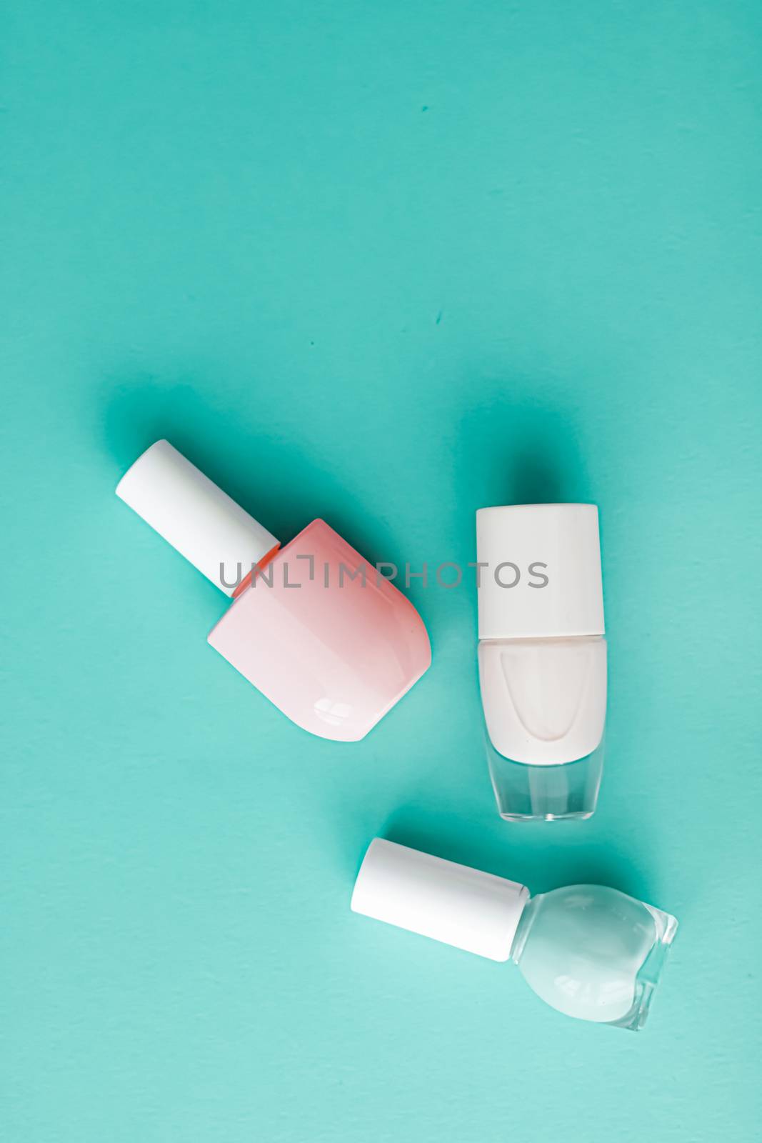 Nail polish bottles on green background, beauty brand by Anneleven