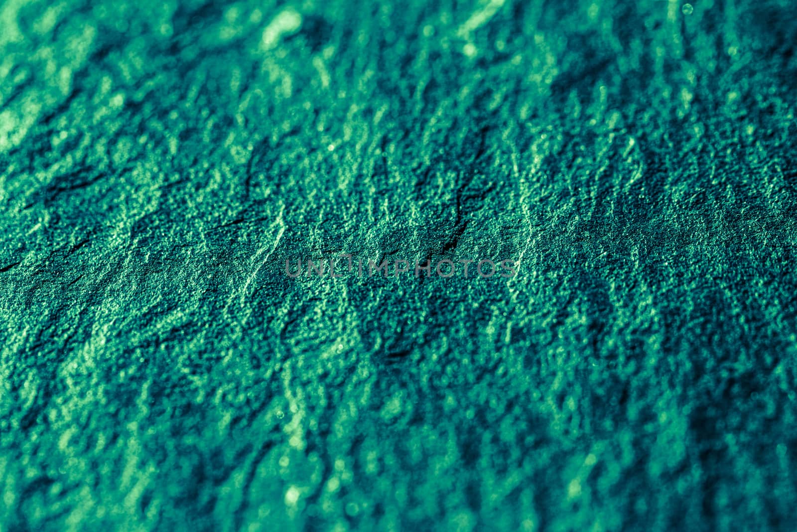 Emerald green stone texture as abstract background, design material and textured surfaces