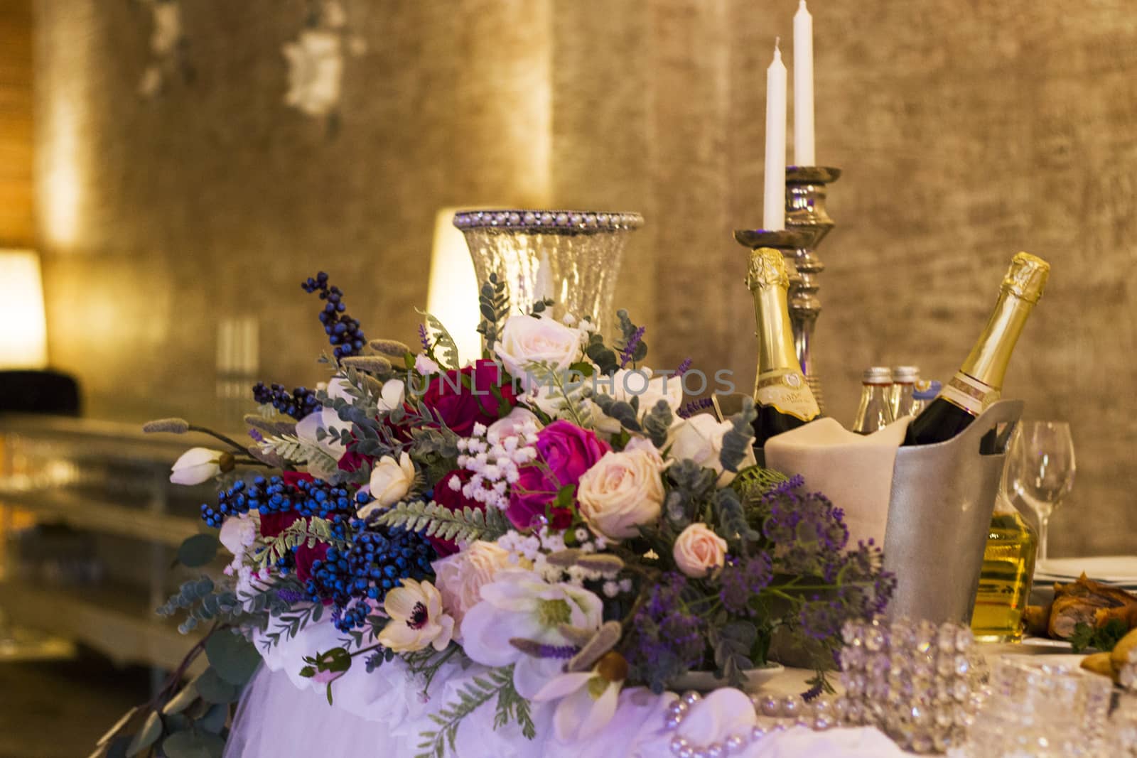 Wedding table design with flowers, candles and lights