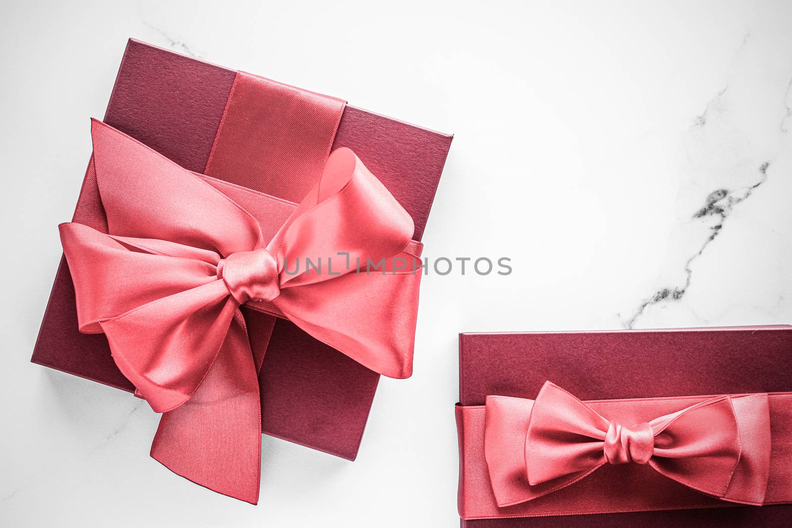 Coral gift box with silk bow on marble background, girl baby sho by Anneleven